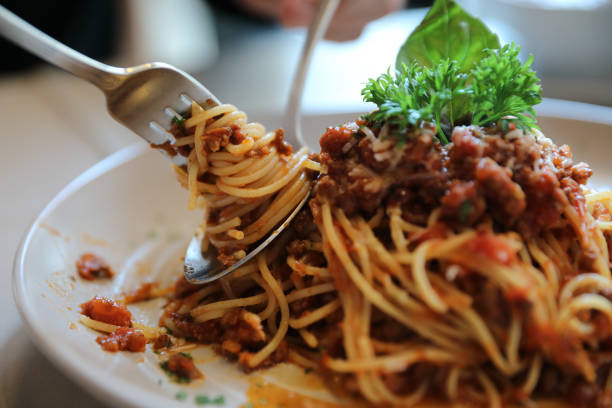 istock spaghetti Bolognese with minced beef and tomato sauce garnished with parmesan cheese and basil , Italian food 949427092