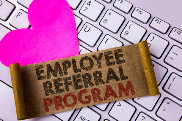 istock Writing note showing  Employee Referral Program. Business photo showcasing strategy work encourage employers through prizes written on Folded Cardboard Paper Piece placed on White Keyboard Heart. 949427304