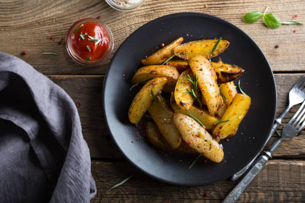 istock Baked potatoes with herbs 949429972