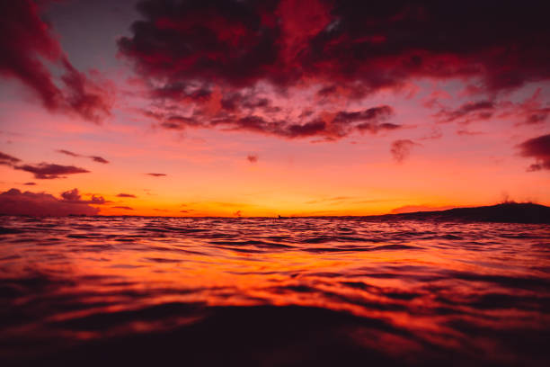 istock Sunrise or sunset at ocean with waves in tropics 949430662