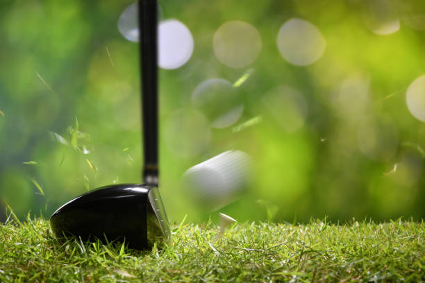 istock Golfer teeing off golf ball from tee on beautiful golf course 949431668