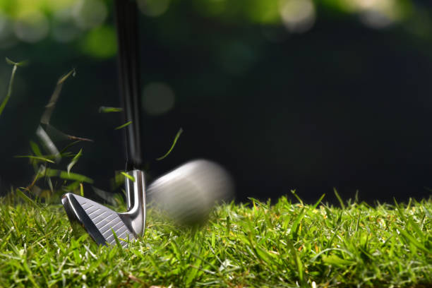 istock Golfer hitting golf ball with club on beautiful golf course 949431782