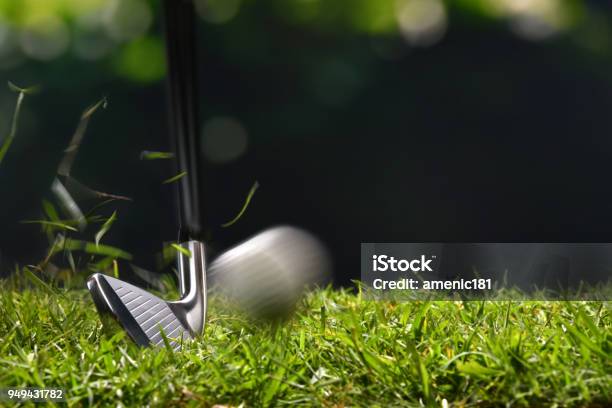 Golfer Hitting Golf Ball With Club On Beautiful Golf Course Stock Photo - Download Image Now