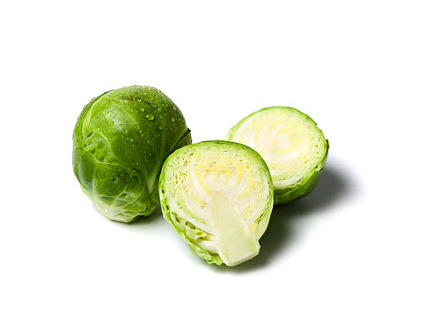 fresh brussels sprouts isolated  brussels sprout stock pictures, royalty-free photos & images