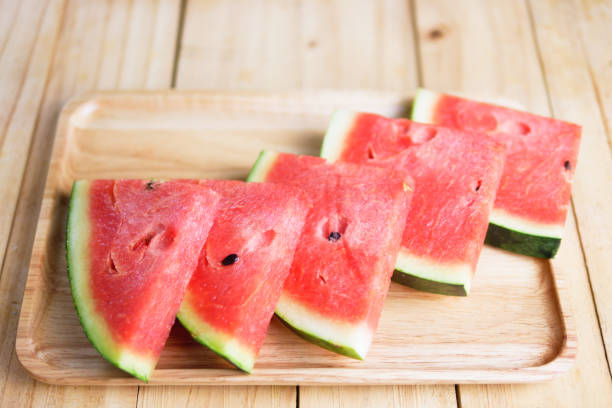 istock Sliced Red watermelon on wooden board 949442152