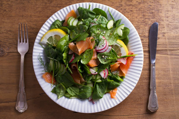 istock Healthy food: salmon spinach radish cucumber salad 949442188