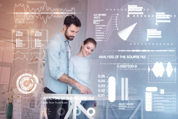 istock Loving couple looking at the scheme on the table and smiling 949442508