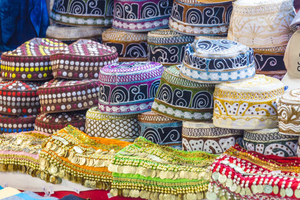 istock Traditional caps at ancient Mutrah Souq, Muscat, Oman 949442958