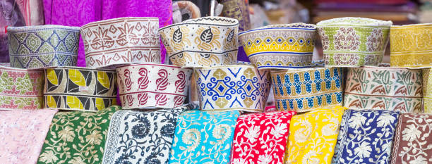 istock Traditional caps at ancient Mutrah Souq, Muscat, Oman 949442982