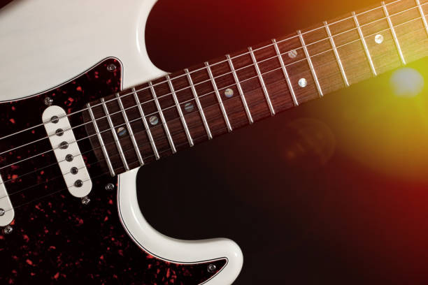istock Live music. Modern electric guitar close-up with stage lights 949446730