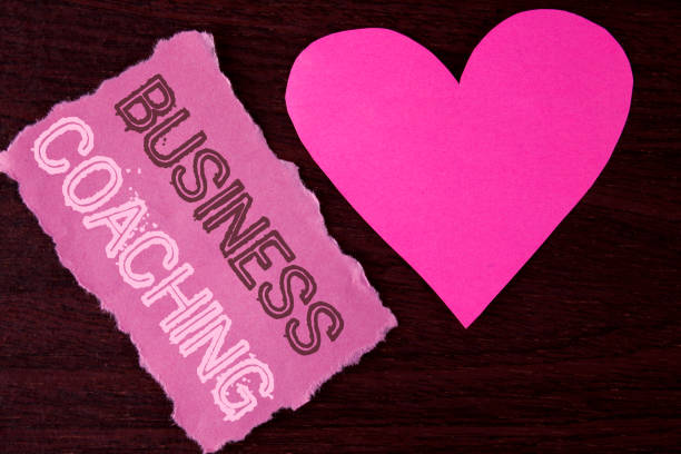 istock Handwriting text writing Business Coaching. Concept meaning consulting expert your field Experience improvement written on Tear Sticky Note Paper Piece on wooden background Heart next to it. 949453858
