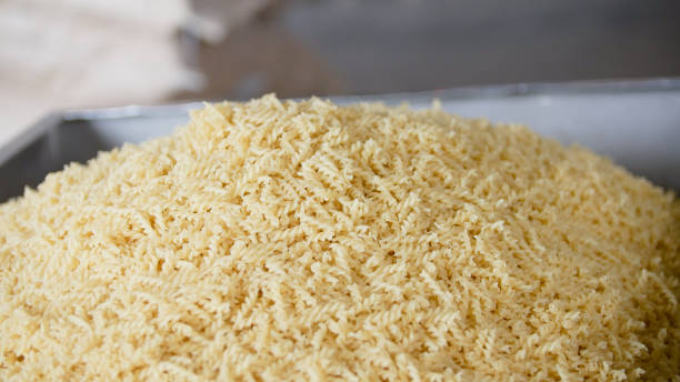 istock Raw macaroni from a conveyor belt at the pasta manufactury 949454258