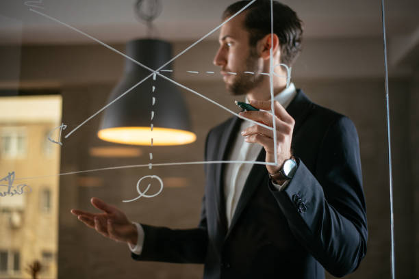 istock Businessman drawing economy chart 949456596