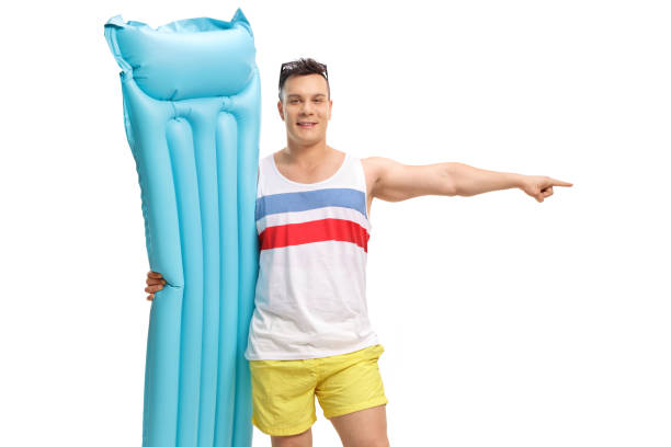 istock Tourist with an air matress pointing 949458264