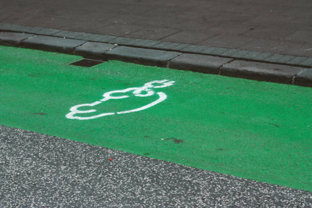 istock Electric car charging symbol on a street 949463016