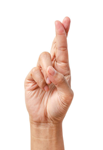 istock Hand with crossed fingers isolated on white background 949467140