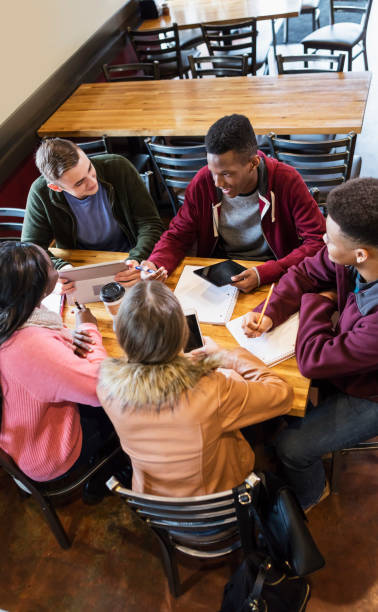 istock Teenagers studying together in coffee shop 949467762