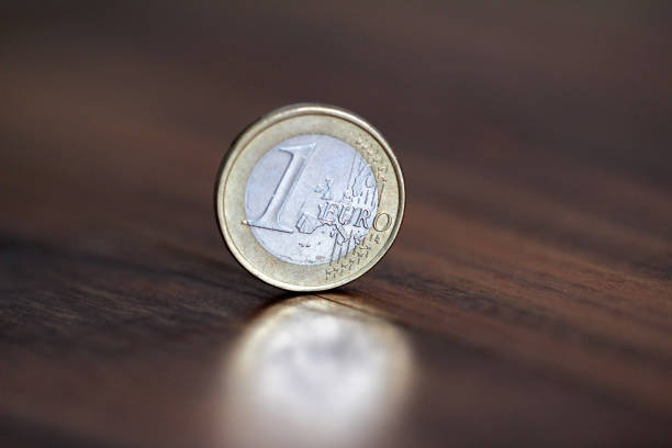 istock A coin worth one euro, stands on the edge 949471918