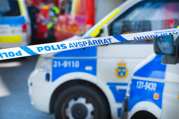 Ambulances and police cars in Stockholm, police line, do not cross stock photo