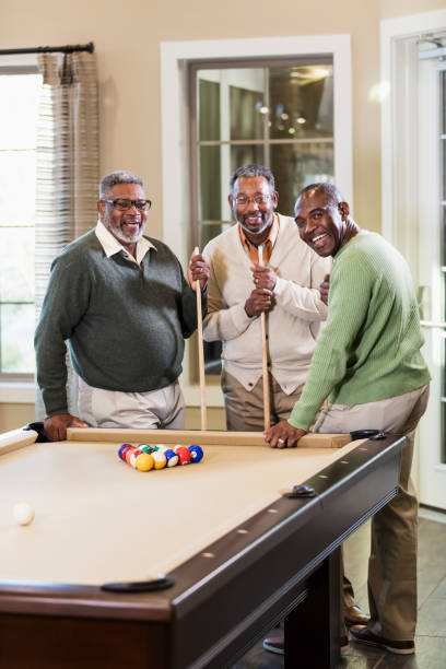 istock Three African-American men shooting pool 949476240