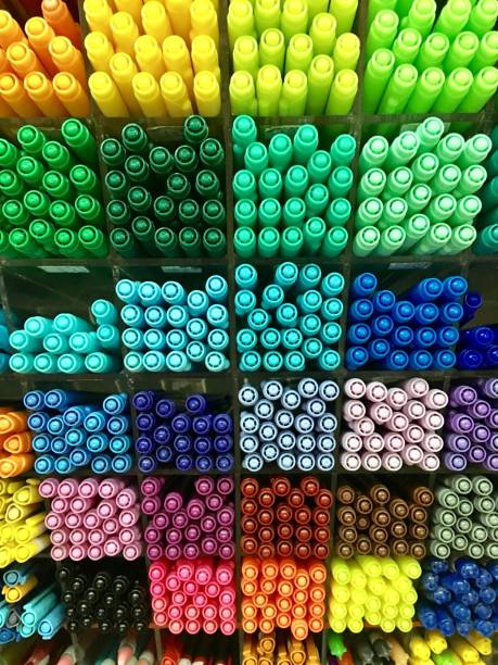 istock Colorful pens arranged on shelves in shop 949476680