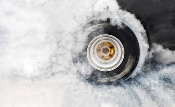 Drag racing car burn tire at start line