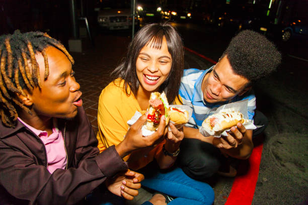 istock Hot dogs with friends. 949482364