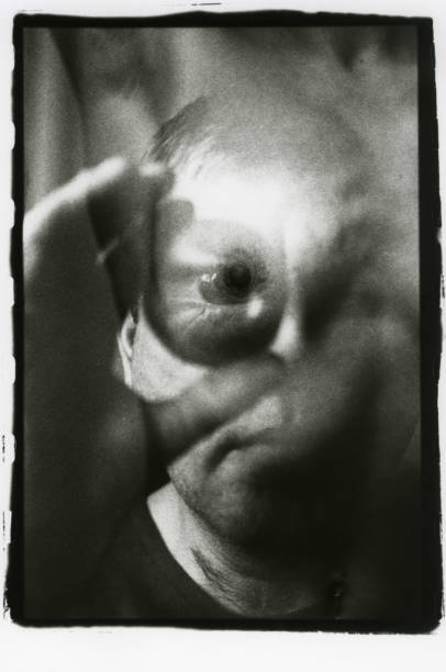 istock A man looks at a female nipple in a magnifying glass. Multiple exposure. 949485636
