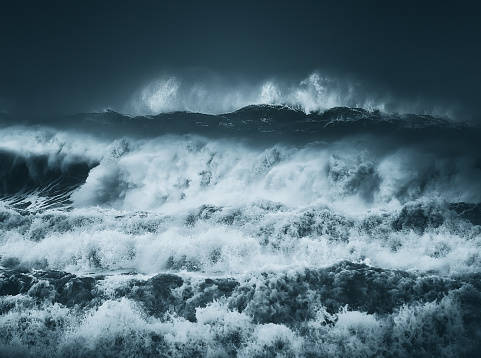dramatic big waves with a dark stormy weather