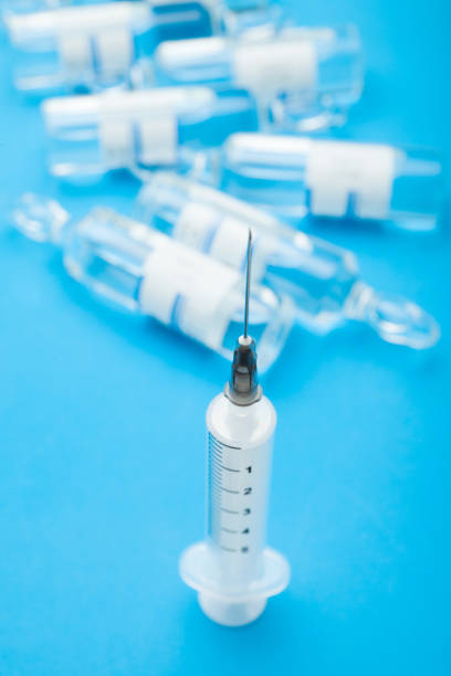istock Glass ampoules on background. 949504102