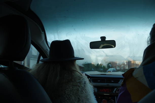 Woman driving in a car on a winter day