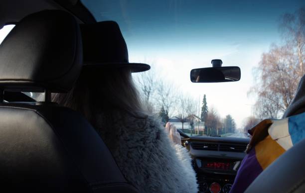 Woman driving in a car on a winter day