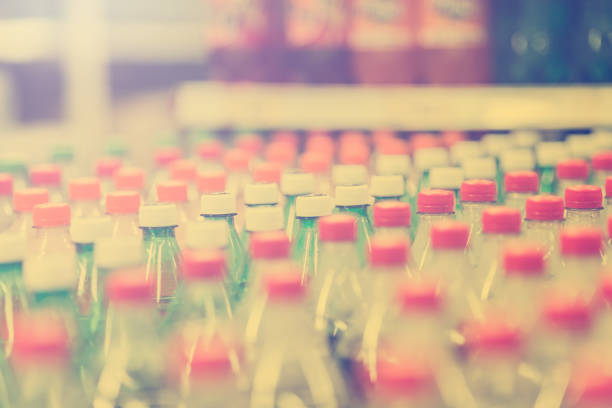 istock Rows of  plastic bottles cap with bllur background 949510580