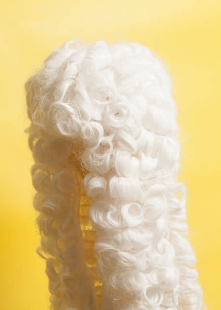 istock Judge wig on yellow background. 949514326