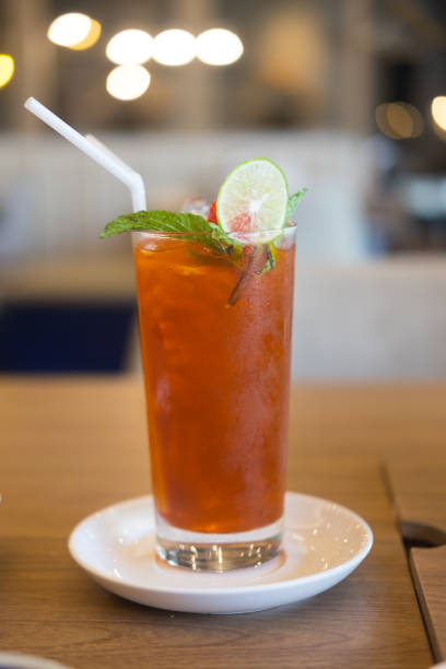 istock Beverages lemon ice tea on wood table 949514532