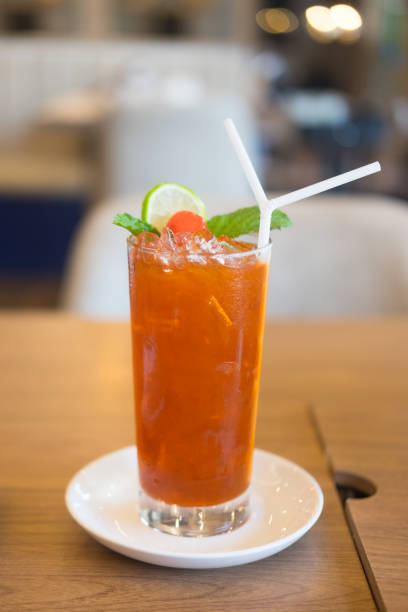 istock Iced tea with lime and ice cubes. Iced cold summer drink 949514536