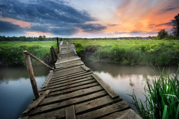 istock Old wooden bridge over the river 949517926