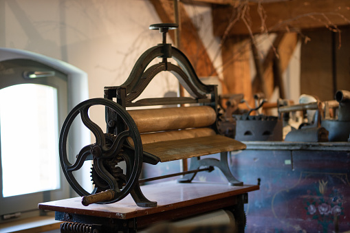 Close-up of an old Embroidery Machine captured in a collection of antique textile machines.