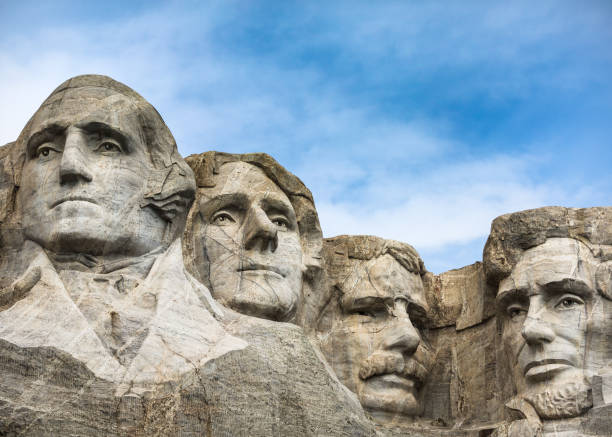 Mount Rushmore Four Presidents Sculptures of George Washington, Thomas Jefferson, Theodore Roosevelt and Abraham Lincoln at Mount Rushmore in the Black Hills of South Dakota. presidents day stock pictures, royalty-free photos & images