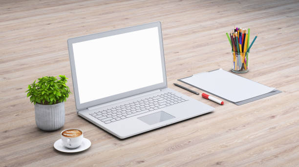 istock Laptop on a desk with accessories, blank screen mock-up isometric 949541634