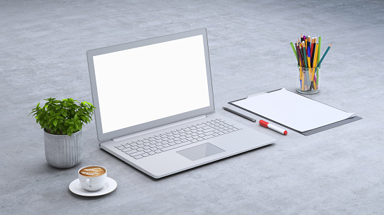 Isometric mock up with large open laptop with blank screen, paper, markers and a plant. Diagonal frame setup. Warm coffee. Modern designer background template. Coffee.