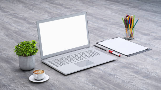 istock Laptop on a desk with accessories, blank screen mock-up isometric 949541642