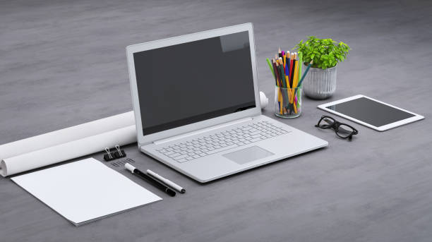 istock Laptop on a desk with accessories, blank screen mock-up isometric 949541704