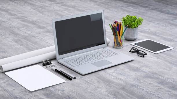 istock Laptop on a desk with accessories, blank screen mock-up isometric 949542282