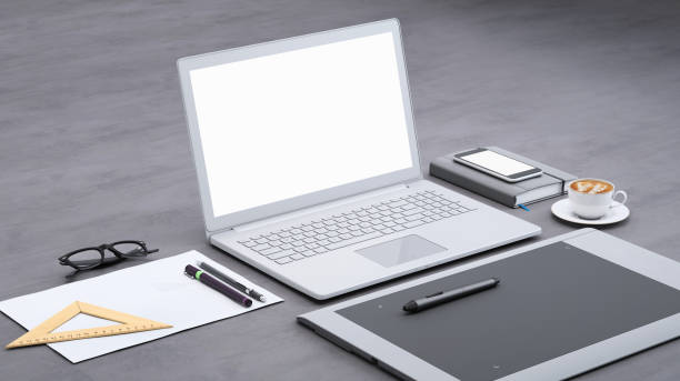 istock Laptop on a desk with graphic tablet, blank screen mock-up isometric 949543804