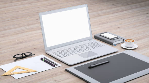istock Laptop on a desk with graphic tablet, blank screen mock-up isometric 949543812