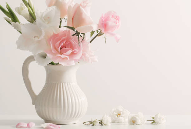 istock pink and white flowers in vase on white background 949561098