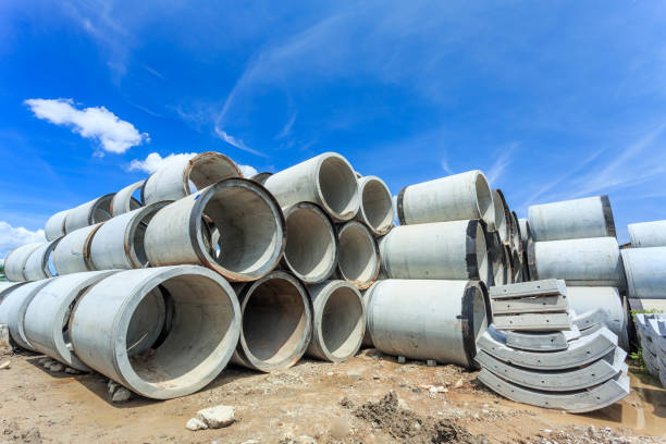 istock Stack of concrete drainage pipes for wells and water discharges 949565250