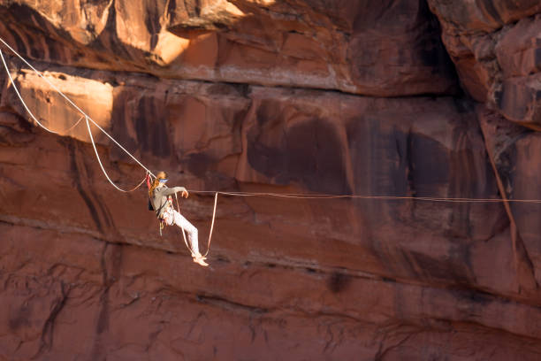 istock Athletic Young Man on a Highline or Slackline in Moab Utah 949565876