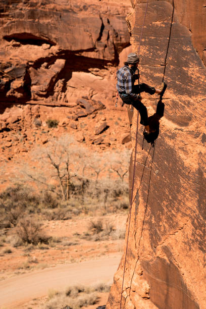 istock Young Man Mountain Climber in Moab 949565888